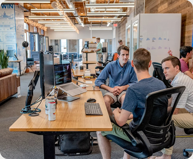 Technology team meeting in an open office